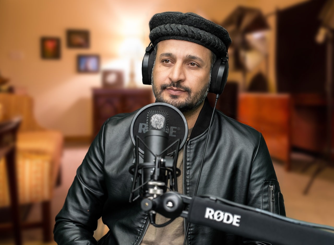 Starting a Podcast - Man Sitting in Front of Microphone Wearing Headphones